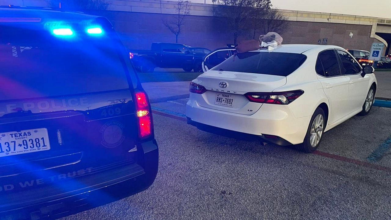 Humble police car and stolen Camry. (Humble Police Department)