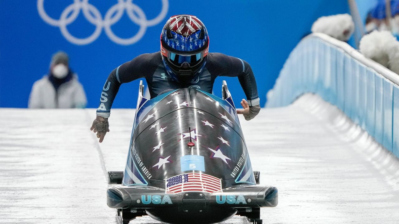 Kaillie Humphries drives Monday during the women's monobob third heat at the Winter in the Yanqing district of Beijing. (AP Photo/Mark Schiefelbein)