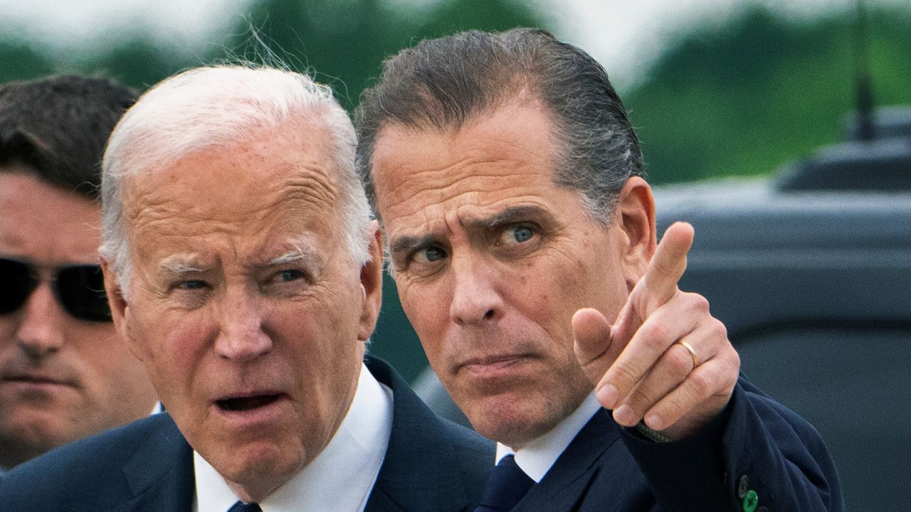 President Joe Biden talks with his son Hunter Biden as he arrives Delaware Air National Guard Base in New Castle, Del., Tuesday, June 11, 2024. (AP Photo/Manuel Balce Ceneta)