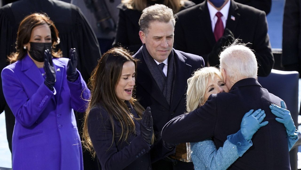 Hunter Biden looks on as his father, President Joe Biden, and stepmother, Jill Biden, hug during the inauguration Jan. 20. (AP Photo/Carolyn Kaster, File)