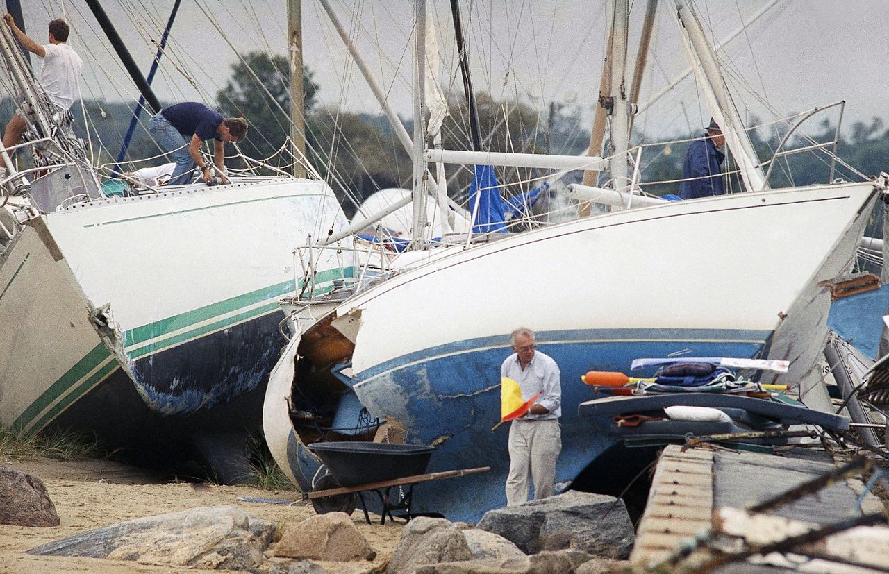 Boat owners gather their belongings, Aug. 20, 1991 in Dartmouth, Mass., after Hurricane Bob swept through southern Massachusetts. The area was closed to the public allowing boat owners to locate and salvage damaged property. (AP Photo/Susan Walsh)