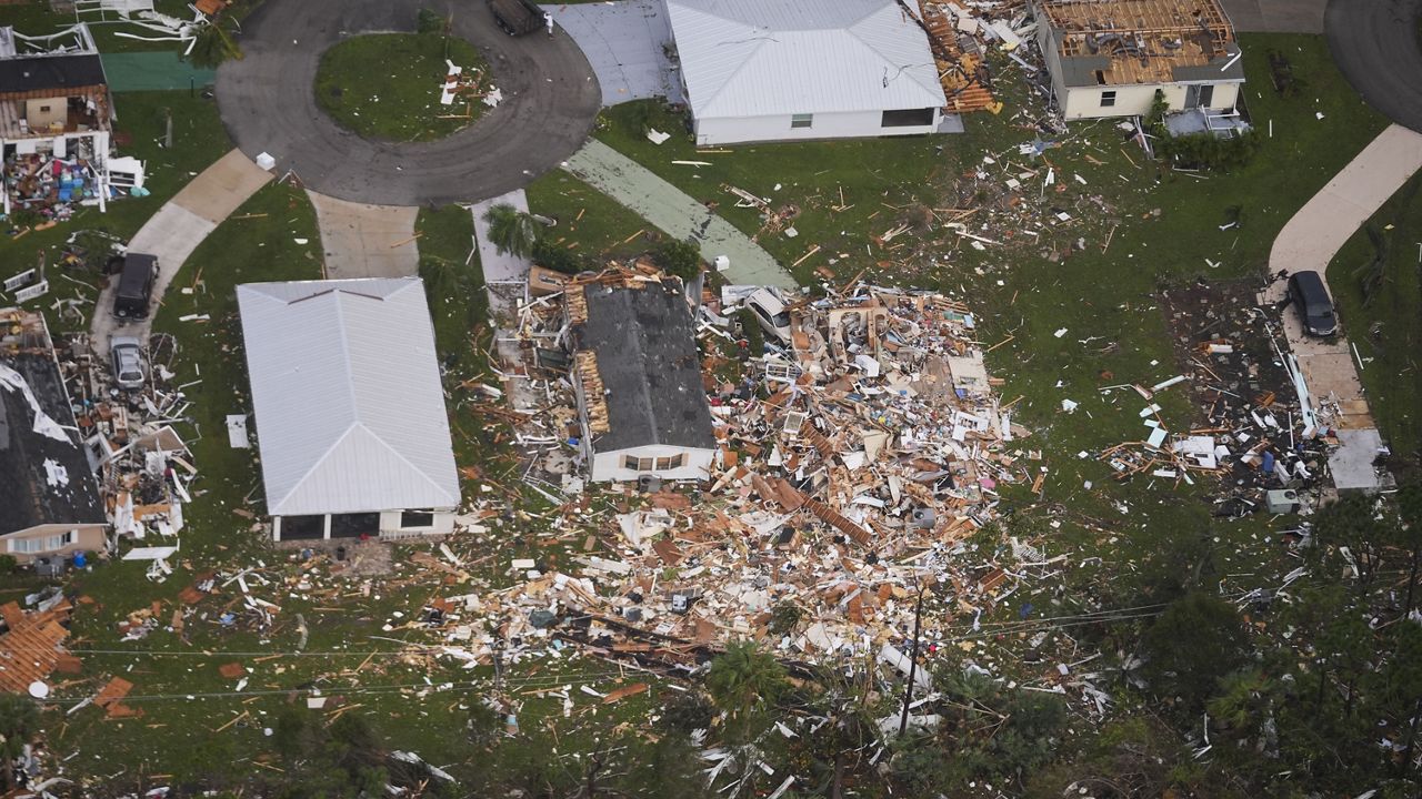 Neighborhoods destroyed by tornadoes are seen in this aerial photo in the aftermath of Hurricane Milton, Thursday, Oct. 10, 2024, in Fort Pierce, Fla. (AP Photo/Gerald Herbert)