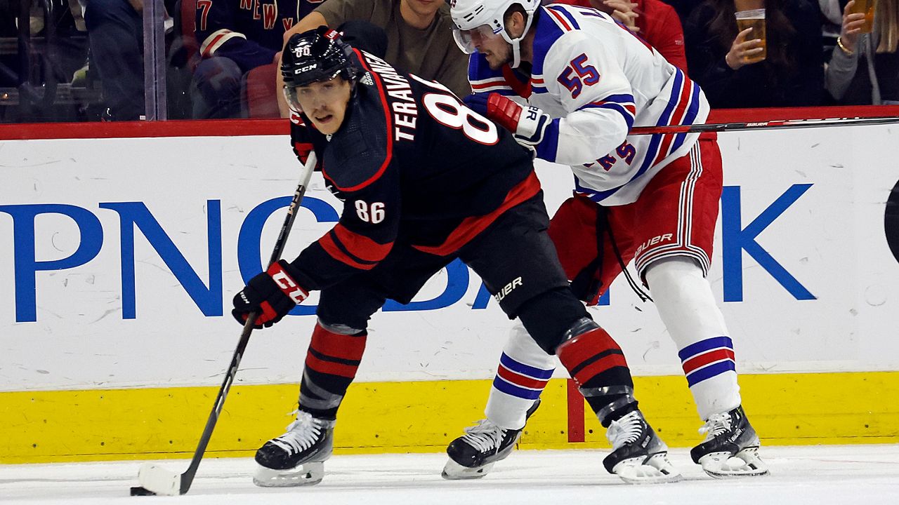 Teuvo Teravainen protects the puck from Ryan Lindgren during Game 4 in Raleigh on Saturday, May 11, 2024.