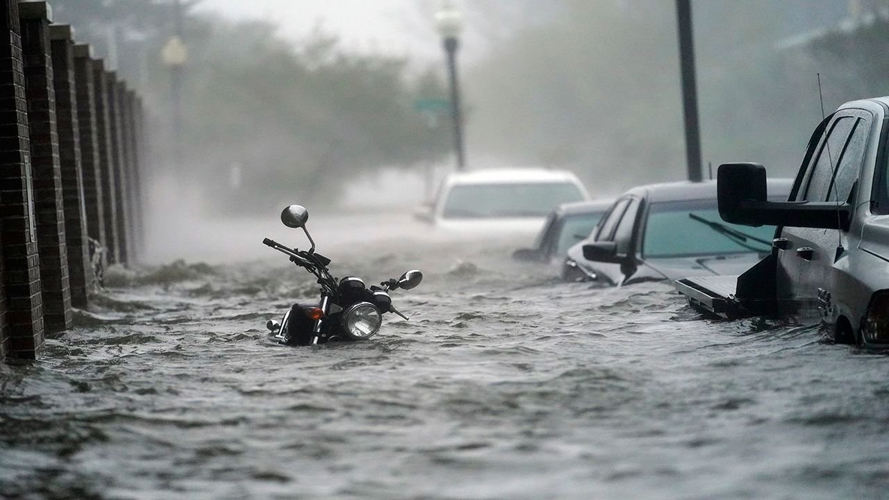 The slow-moving Sally has dropped over two feet of rain along parts of the Gulf Coast. (Associated Press photo)