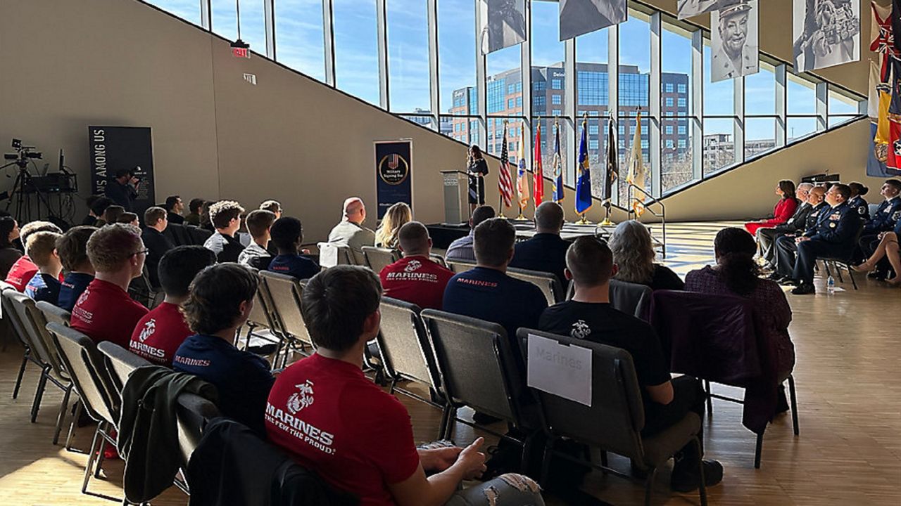 High school military commits listening to Ohio Second Lady, Tina Husted, give congratulatory remarks to them at the National Veterans Memorial and Museum.