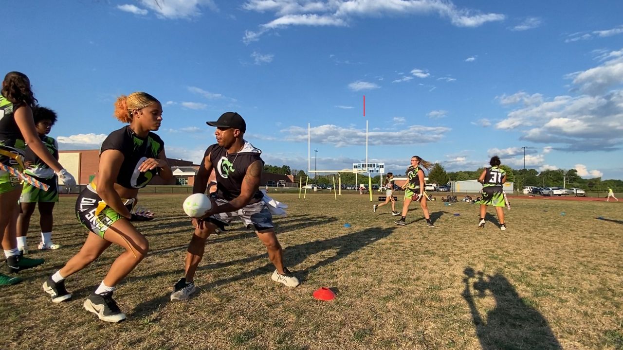 Woman becomes first flag football player with gear in Pro Football Hall of  Fame