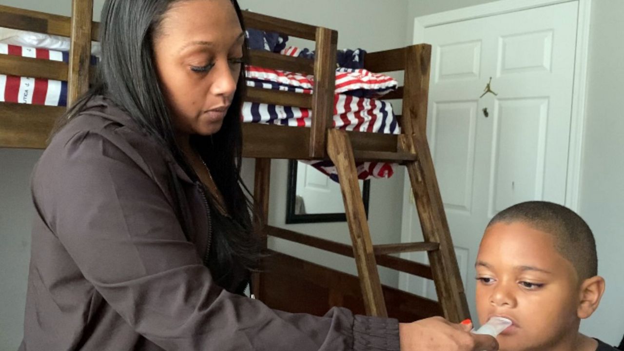 parent helps child breathe