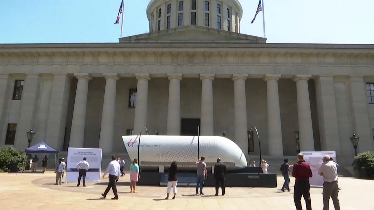 People looking at a model of the Hyperloop at Ohio Statehouse 