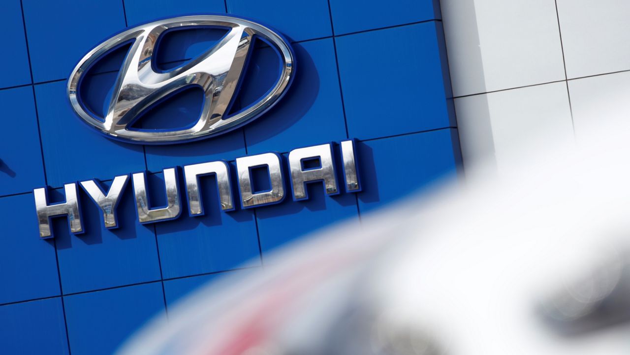 In this April 15, 2018, file photo, the company logo hangs on the side of a showroom at a Hyundai dealer in Littleton, Colo. (AP Photo/David Zalubowski)