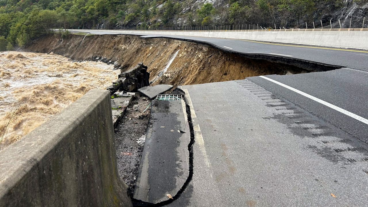 This photo provided by the North Carolina Department of Transportation shows the collapsed eastbound lane of I-40 into the Pigeon River in North Carolina near the Tennessee border, Sept. 28, 2024. (N.C. Department of Transportation via AP, File)