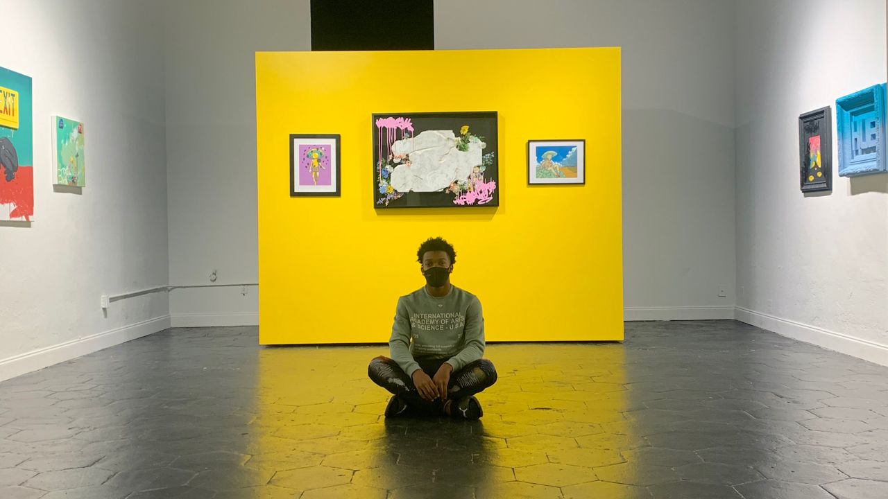 Jabari "iBOMS" Reed-Jiop, pictured at his "Ego Death" exhibit at MIZE Gallery, is a Fairgrounds participant. (Image courtesy MIZE Gallery)