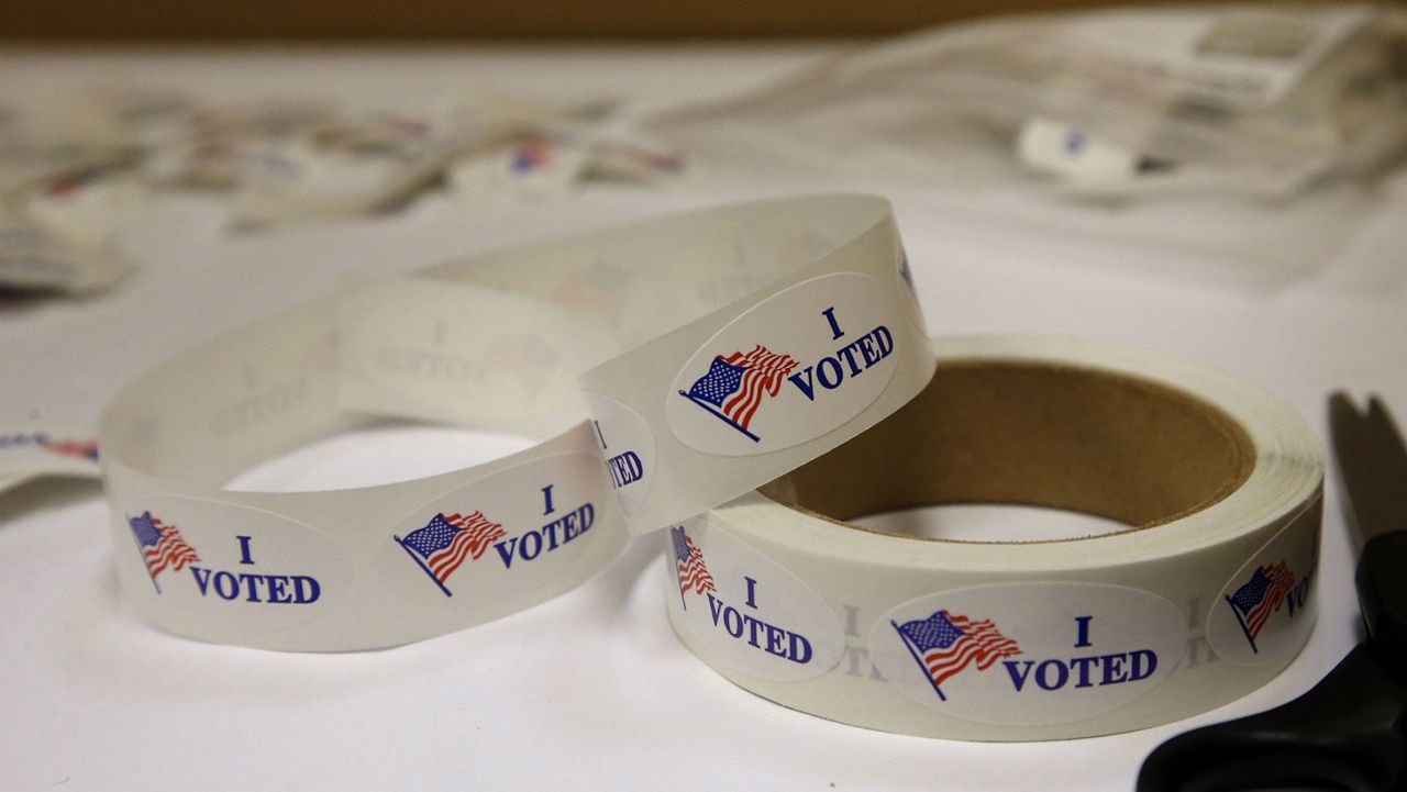 Multiple rolls of "I voted" stickers.  (AP Photo/Sue Ogrocki)