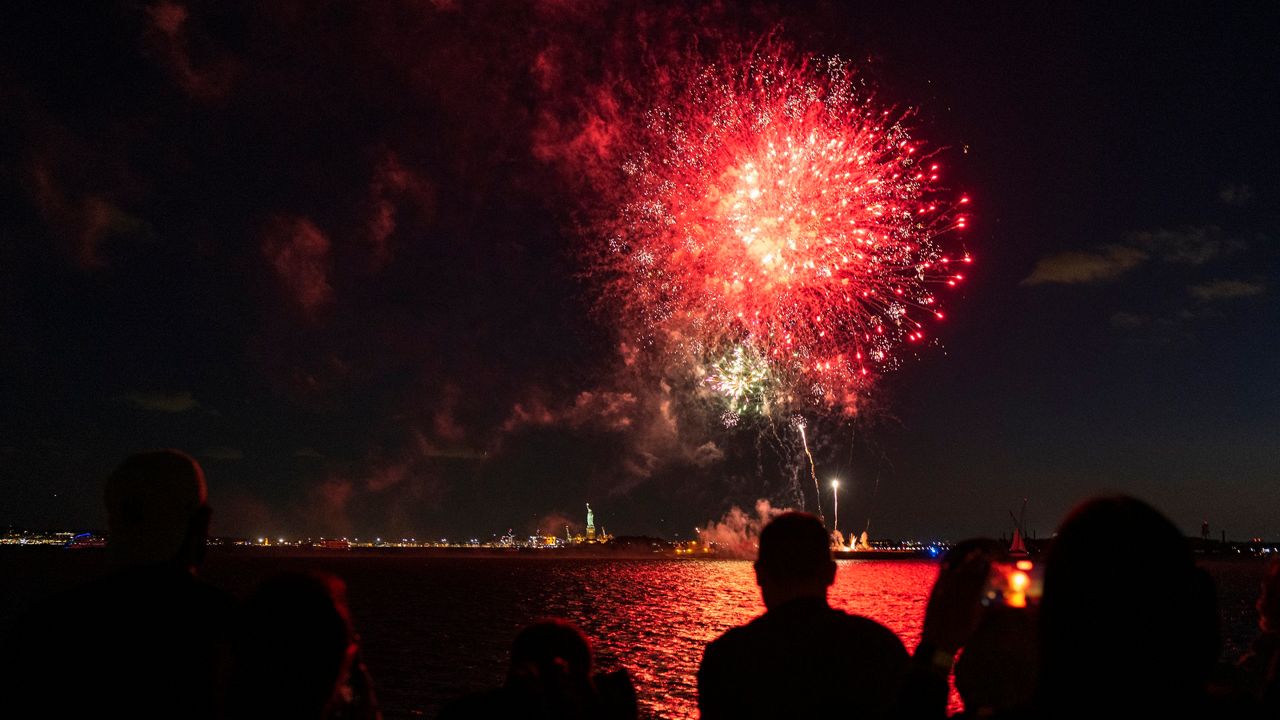 Fireworks explode over New York Harbor on June 15, 2021