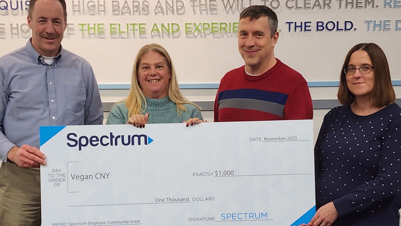 Spectrum donates $1,000 to Vegan CNY to support healthy meals for food insecure families in the area. Shown left to right are: Doug MacEwen, Charter manager, Enterprise Process Management, Jessica Lardeo, Charter business analyst, Jim Thompson, vice president, Vegan CNY, and Stephanie Langer-Liblick, treasurer, Vegan CNY. 