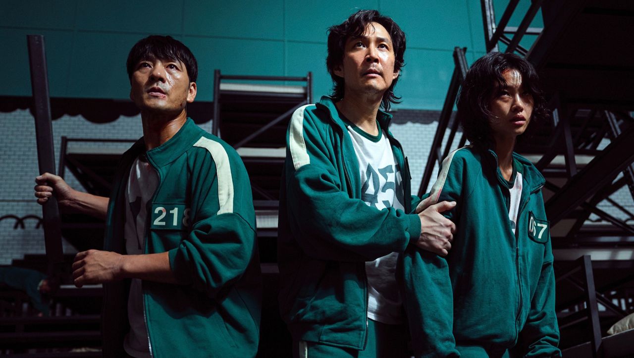 This undated photo released by Netflix shows South Korean cast members, from left, Park Hae-soo, Lee Jung-jae and Jung Ho-yeon in a scene from "Squid Game." (Youngkyu Park/Netflix via AP)