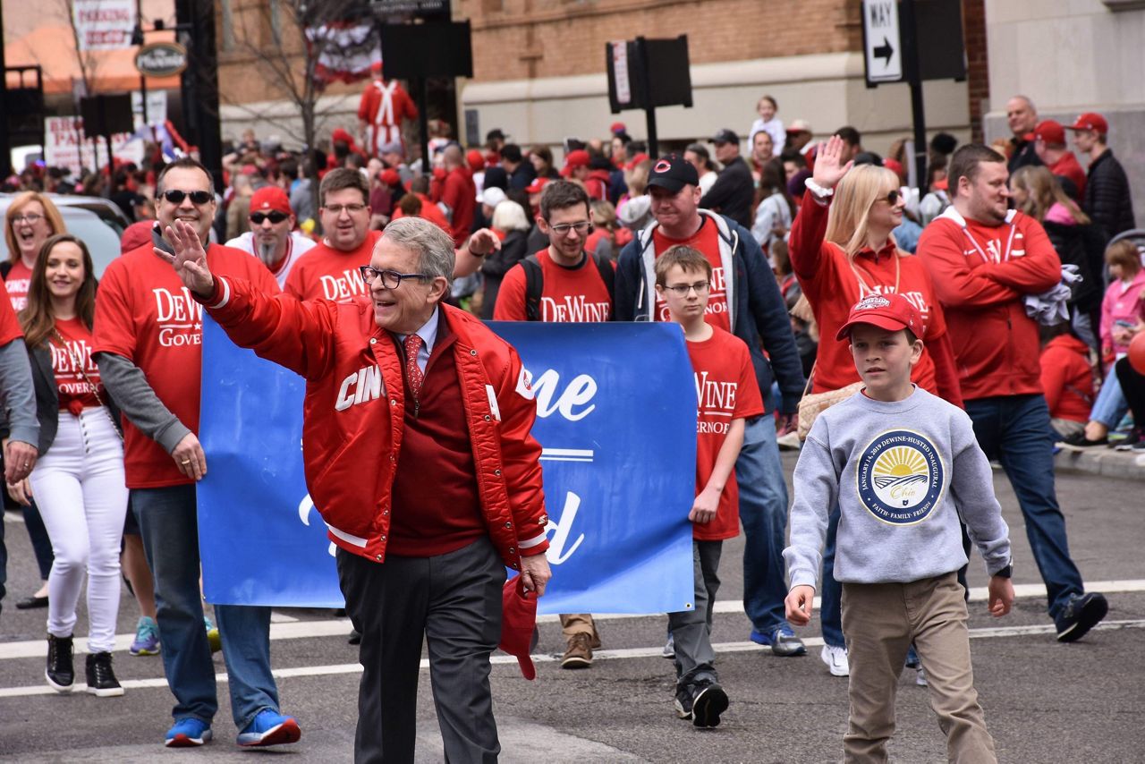 Ohio Gov. Mike DeWine (R) walks in the Findlay Market Opening Day Parade in downtown Cincinnati. (Spectrum News 1/Casey Weldon)