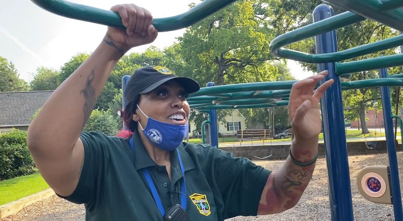 Park Ranger Shatora Wilson surveys monkey bars for damage