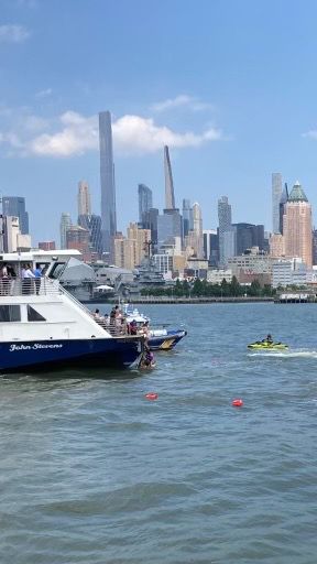 People seen climbing aboard a NY Waterways ferry at the scene of a Hudson River boating incident that left a dozen injured. The ferry operator said a private boat "overturned" in a statement. (NY Waterways)