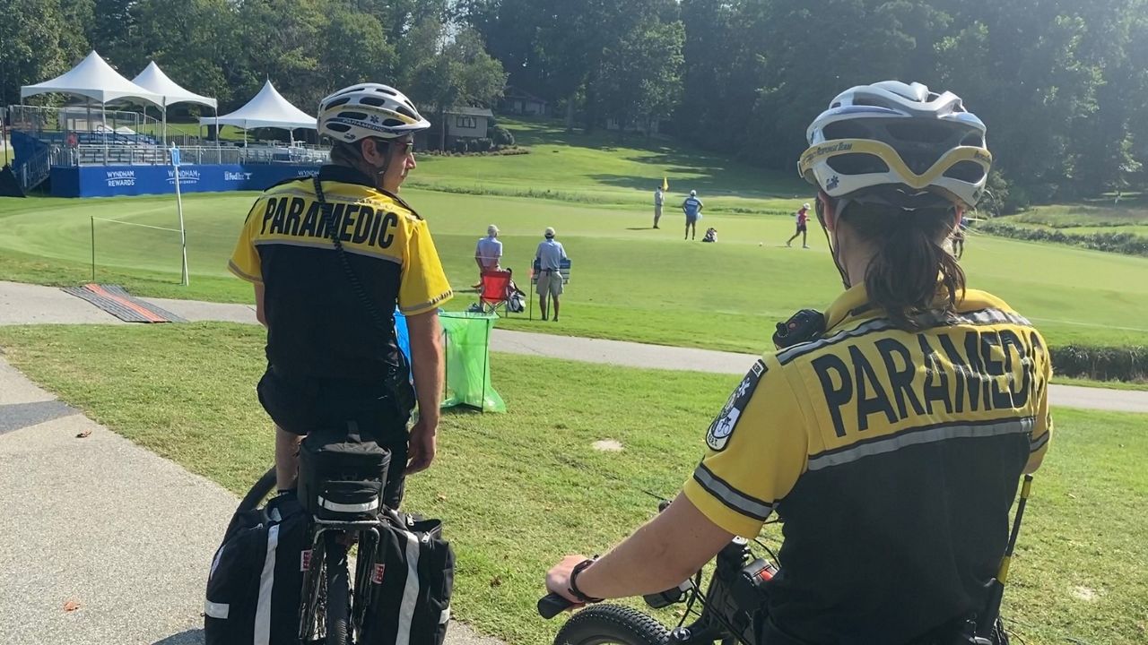 Paramedics observe players at the Wyndham Championship in Greensboro. 