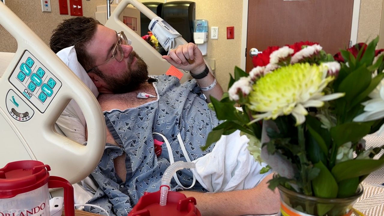 Spectrum News 13 photojournalist Jesse Walden remembers his friend, coworker Dylan Lyons, as he recovers in the hospital. (Spectrum News/Barry Short)