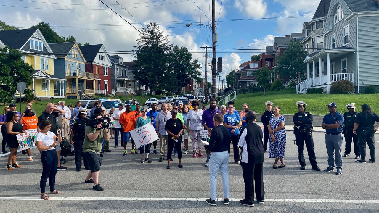 The group assembled on Blair Avenue in Evanston ahead of a half-mile walk around the neighborhood. (Casey Weldon/Spectrum News 1)