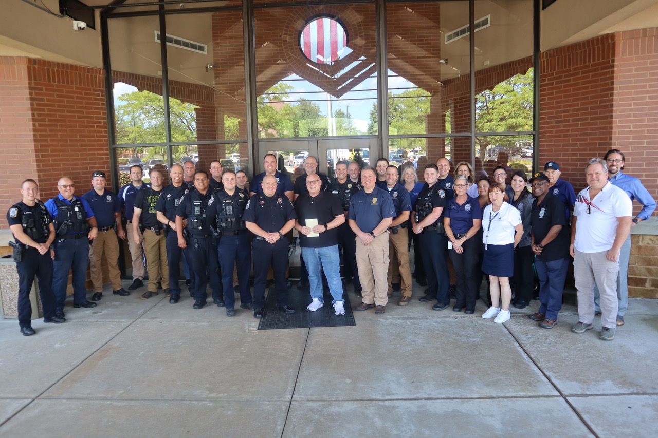 Members of the Colerain Township Police Department join retired Mark Denney on his last day on the job. (Photo courtesy of Colerain Township)