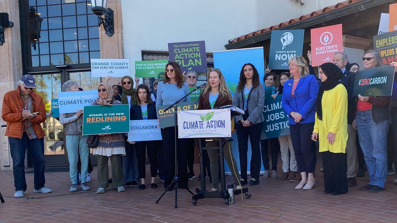 Climate activists joined by like-minded politicians gathered Wednesday to push for a formal climate action plan that would compel the county and cities to follow through on green policies. (Spectrum News/William D'Urso)