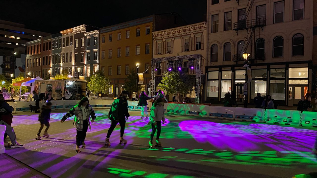 People skate on a pop-up roller rink in downtown Cincinnati during BLINK. (Casey Weldon/Spectrum News 1)