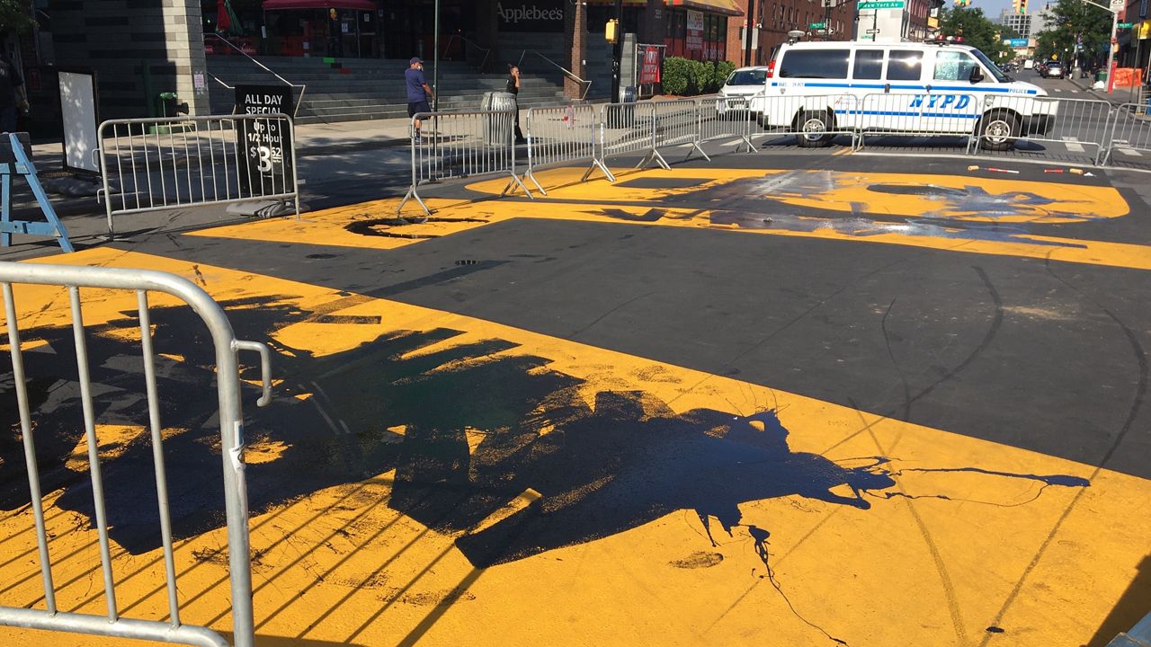 Black Lives Matter mural vandalized blue paint Trump Tower