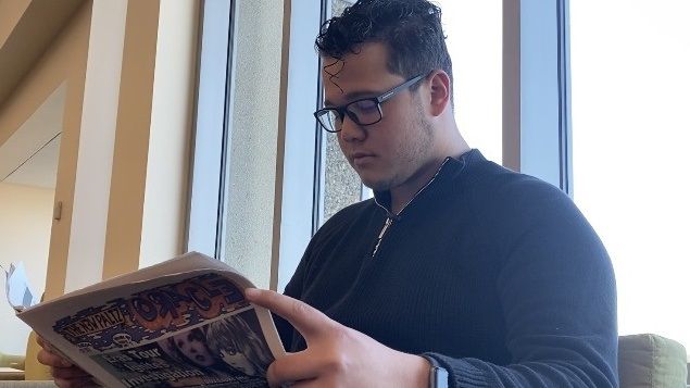 Man reading paper.