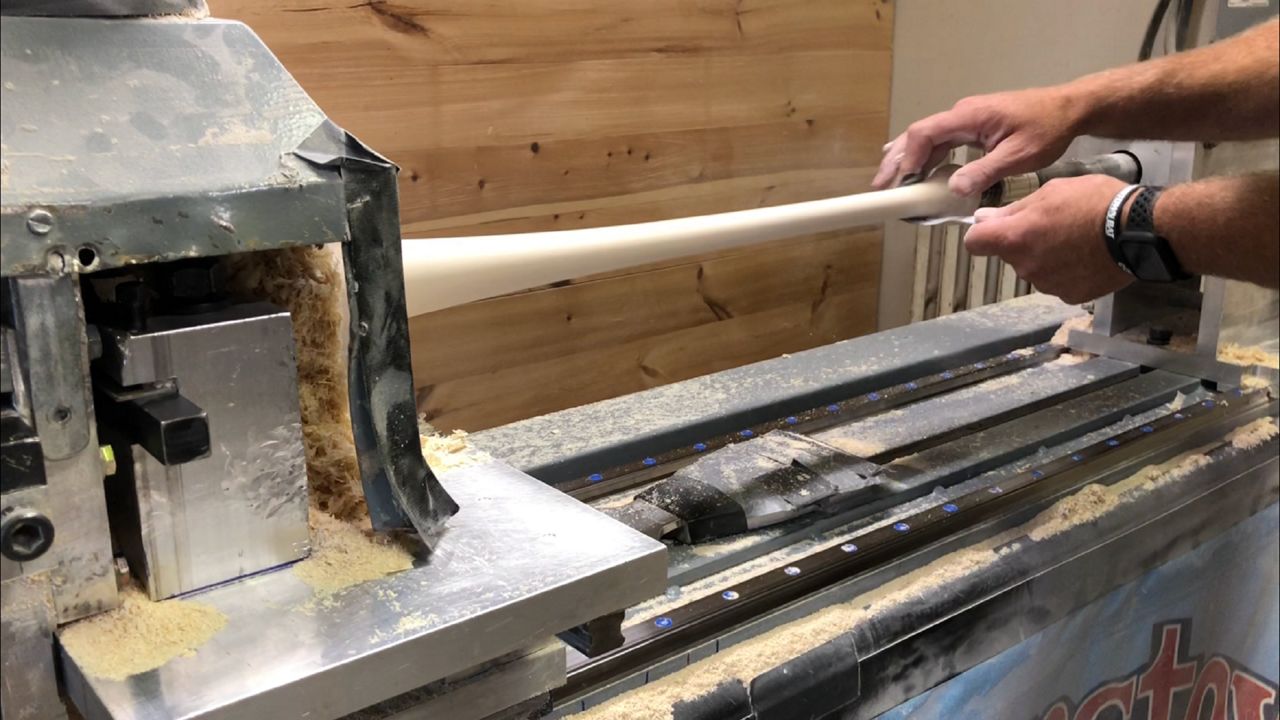 Tim Haney works to build a baseball bat in the Cooperstown Bat Company's factory in Hartwick.