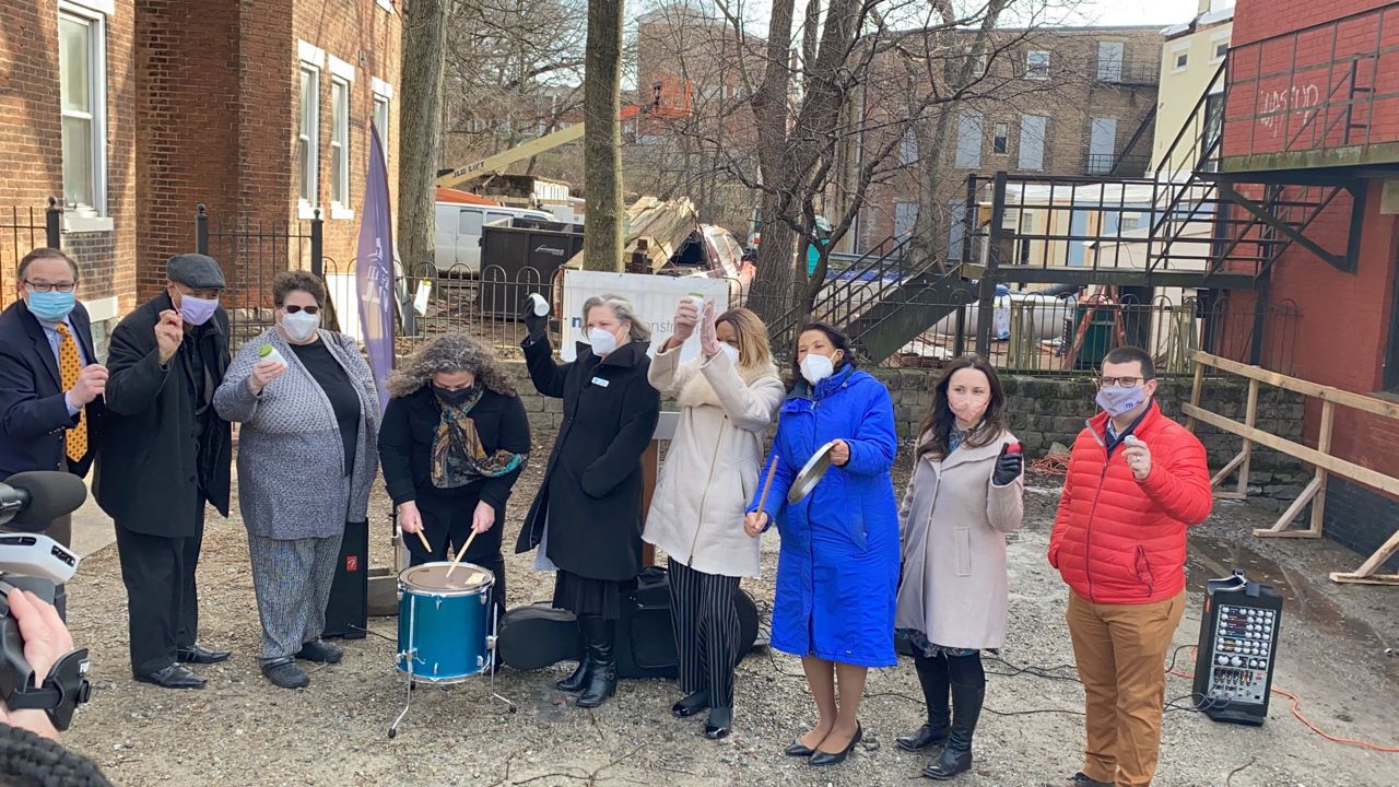 Partners in the Warsaw Avenue Creative Campus play percussion instruments to celebrate the groundbreaking of the East Price Hill project. The act was an homage to MYCincinnati youth orchestra. (Spectrum News 1/Casey Weldon)