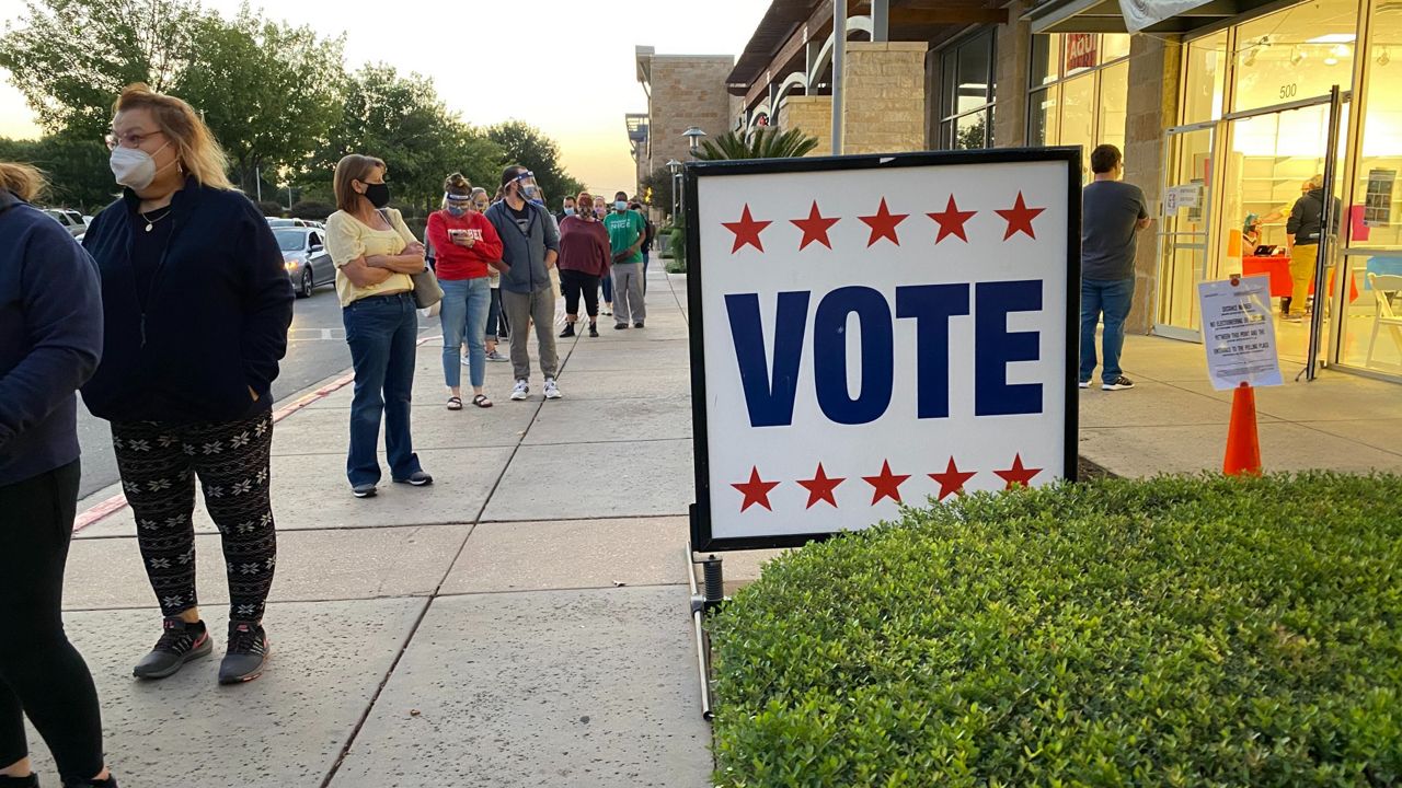 People stand in line at an early voting location in Austin, Texas, in this image from October 13, 2020. (Reena Diamante/Spectrum News)