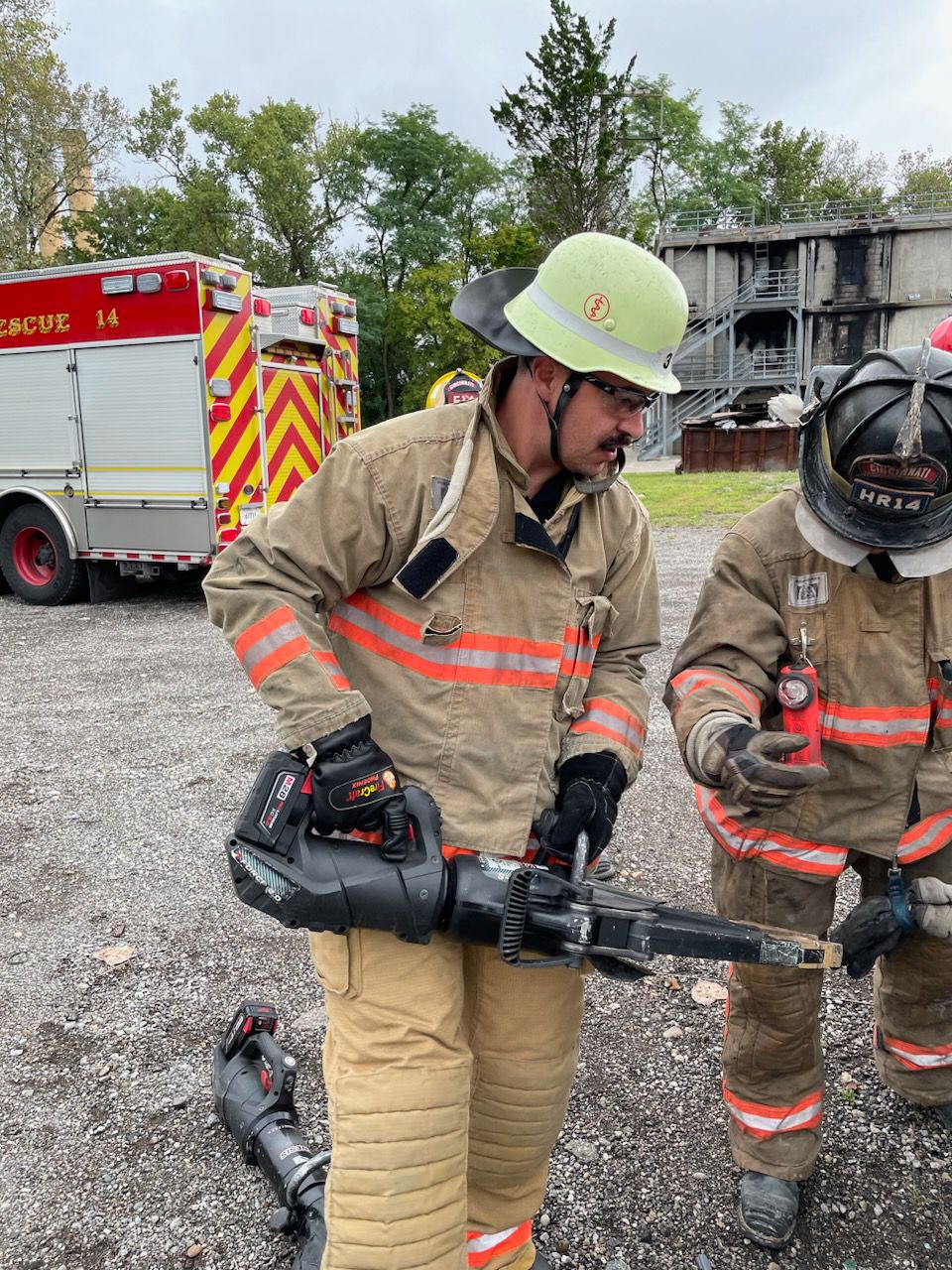 Firefighter Philip Knecht uses a piece of equipment while training with the Cincinnati Fire Department. (Photo courtesy of Cincinnati Fire Department)