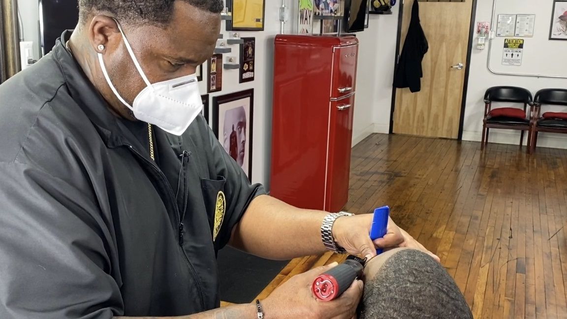 Grateful barber offering a clean cut — and a leg up