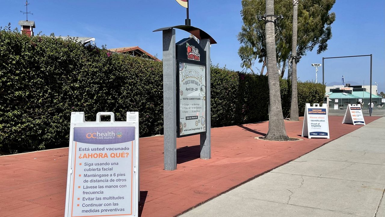 A sign gives guidance in Spanish on what to do after receiving the COVID-19 vaccine at the Orange County fairgrounds in Costa Mesa, Calif. (Spectrum News 1/Paco Ramos-Moreno)