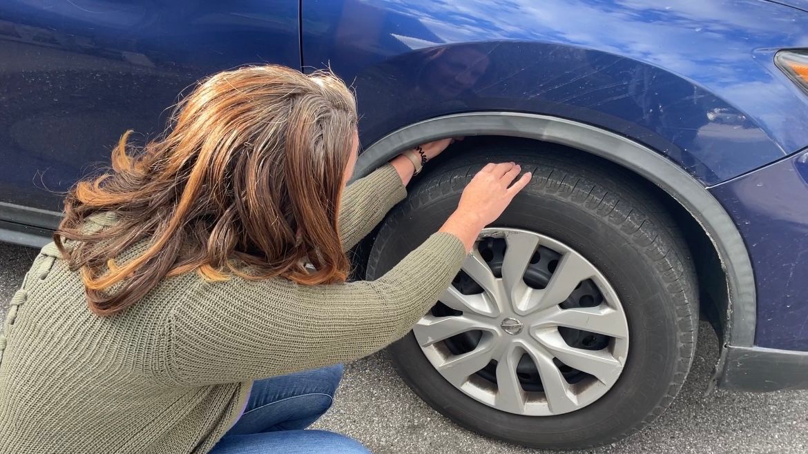 Laila Johnston demonstrates her routine of checking her vehicle for any animals seeking warmth, specifically cats. 