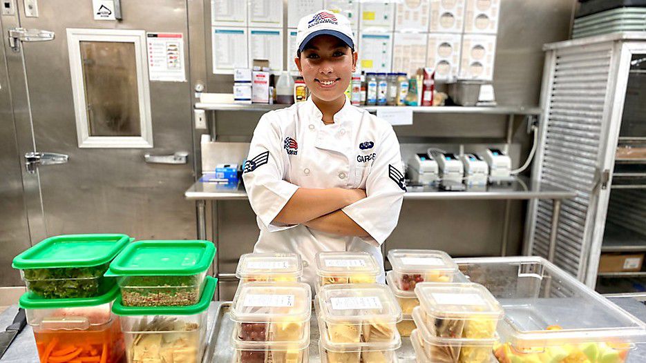 Photo Credit: Alese Underwood  U.S. Air Force Senior Airman Hailey Garces receives distinguished culinary award