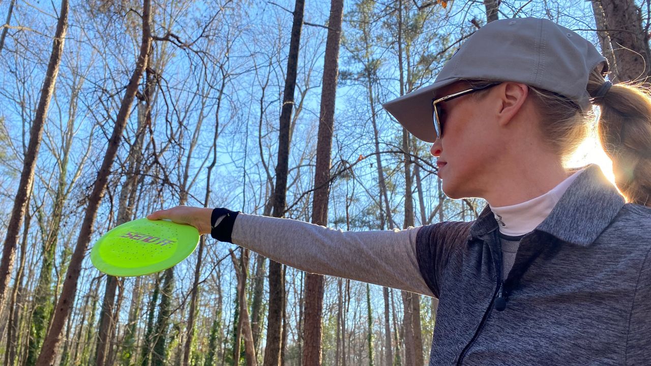 Holly Finley plays in disc golf courses in Charlotte