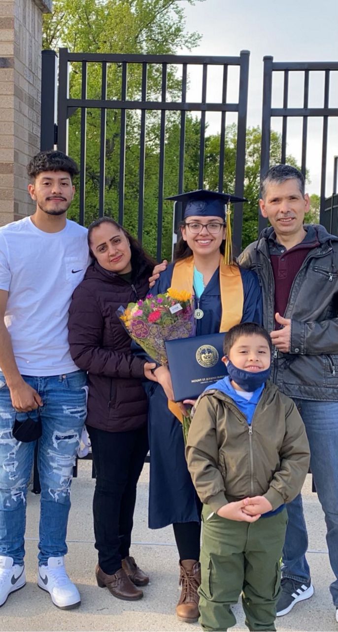Jasmin Luna-Villa (middle) poses with her parents and two brothers at the Mount St. Joseph University graduation.  (Photo courtesy of Jasmin Villa-Luna)