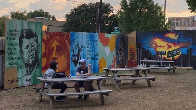 Dallas's Deep Ellum district was covered with murals painted on plywood window coverings by local artists after the May riots. Those murals are now on display at the Deep Ellum Art Company. (Photo by Sabra Ayres/Spectrum News)