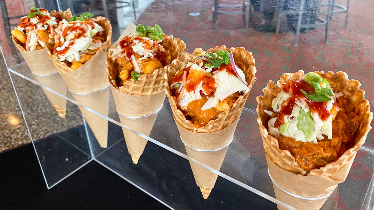 The Bar-B “Cone”: Montgomery Inn pulled pork, white cheddar mac and cheese, coleslaw and Montgomery Inn Barbecue sauce. It's served in a waffle cone. (Casey Weldon/Spectrum News 1)