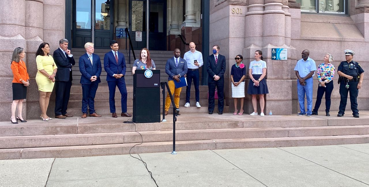 Cincinnati Pride chair Jen Scott delivers remarks during the flag raising at City Hall. (Casey Weldon/Spectrum News 1)