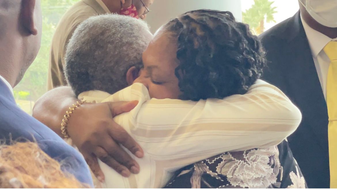 Carol Greenlee shares a hug after her father was officially exonerated Monday in a rape case from 1949. (Spectrum News 13/Nicole Griffin)