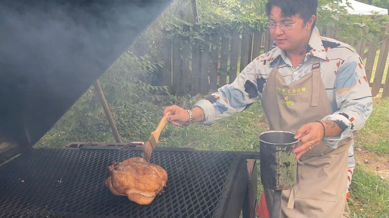 Silver Cousler prepares food on the grill using Filipino techniques.