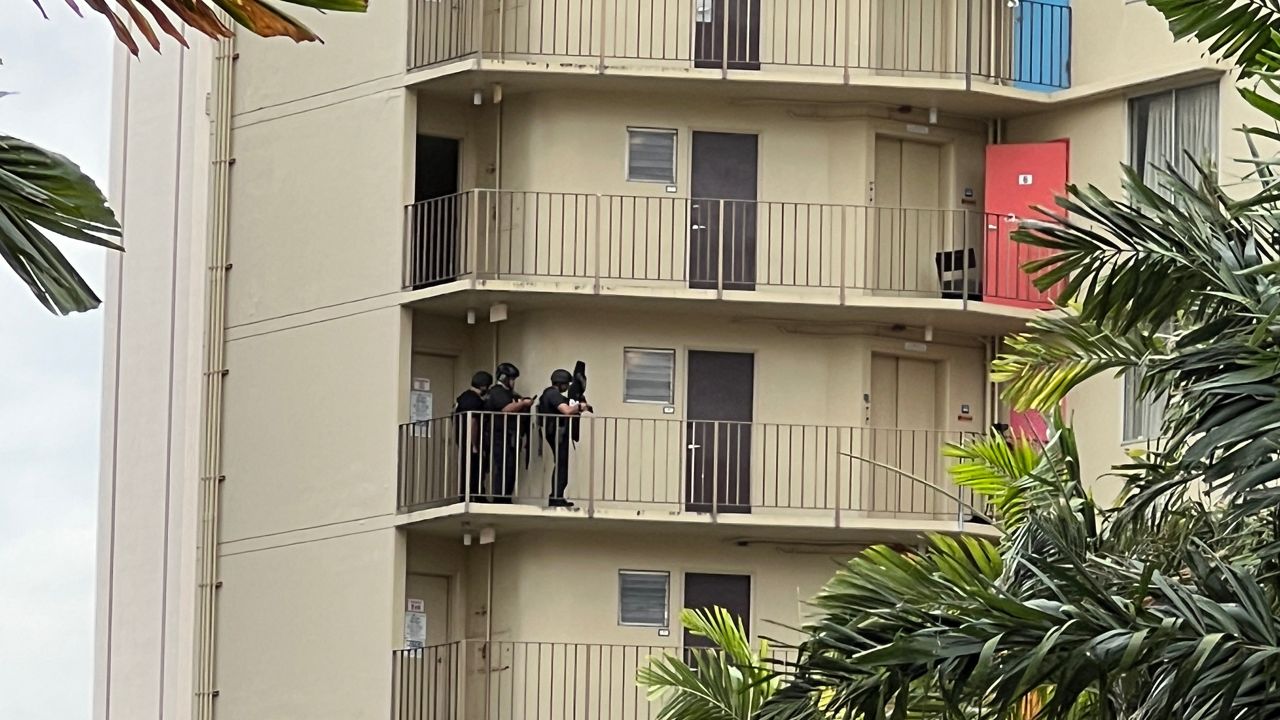 Police are seen at the Ohia Waikiki. (Spectrum News/Ryan Cooper)