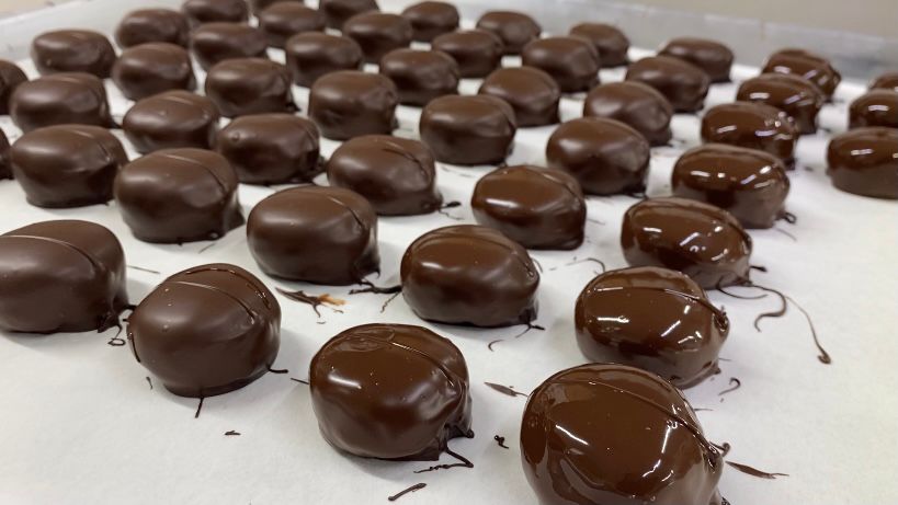 Chocolates cooling after being freshly dipped at Burry Chocolates