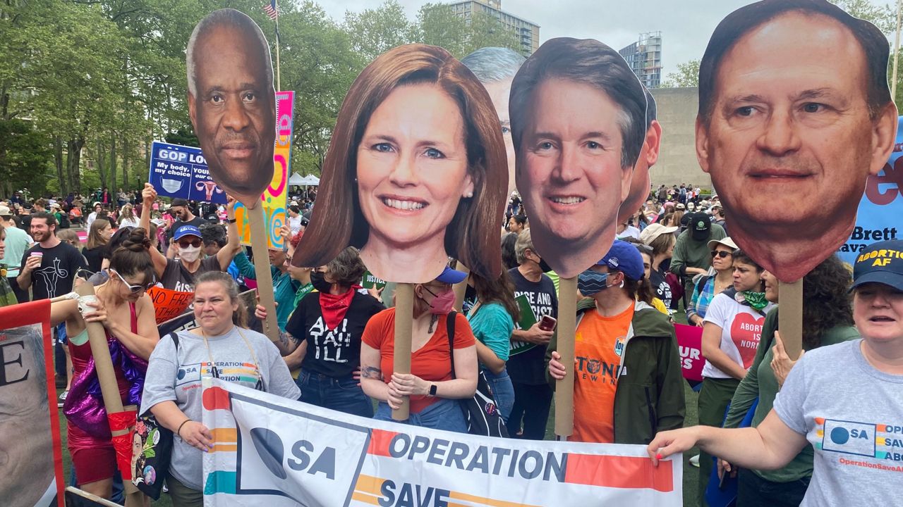 Abortion-rights marchers gather to protect Roe v. Wade