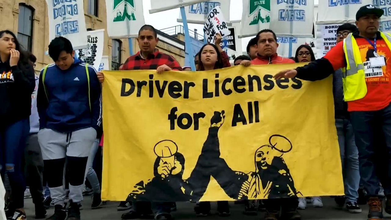 Day Without Latinxs protesters march around Capitol Square Wednesday.