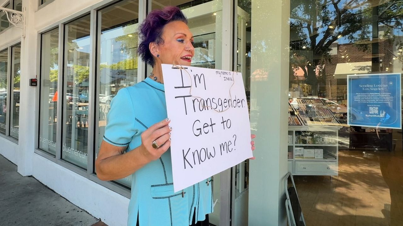 India Miller in downtown Sarasota livestreaming and sharing her message with the community. (Spectrum News)